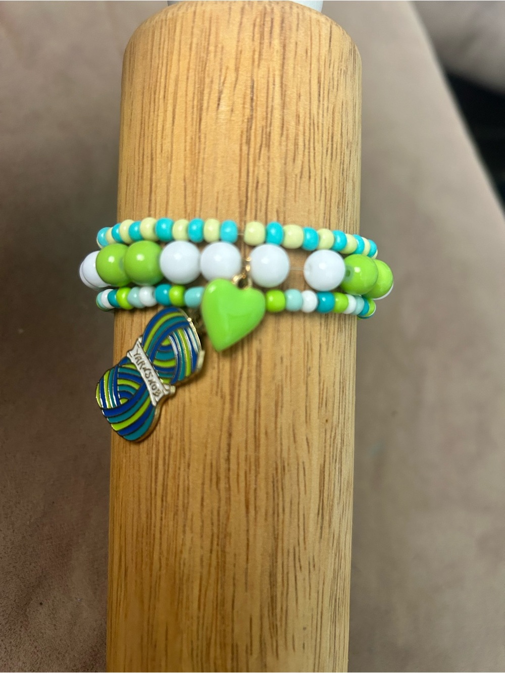 Beaded Wrap Bracelet with Green Heart Charm and yarn snob charm